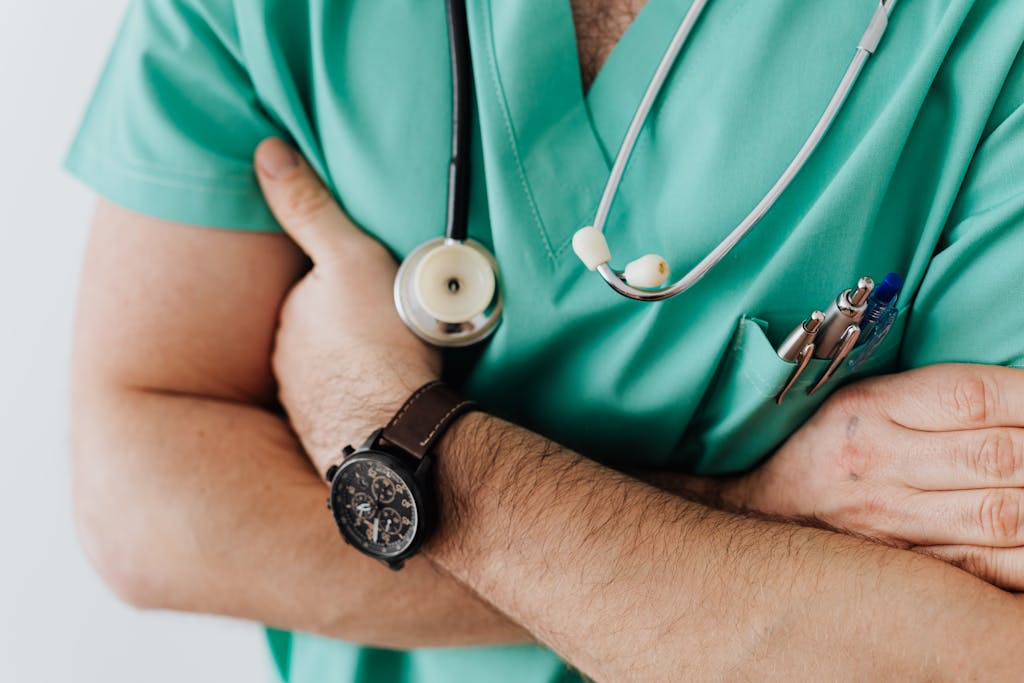 Crop doctor with stethoscope in hospital